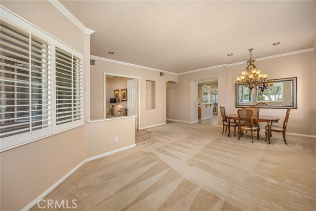 Beautiful open entry gives you a view of the den to the left, living/dining rm to the right and kitchen-family room straight ahead.