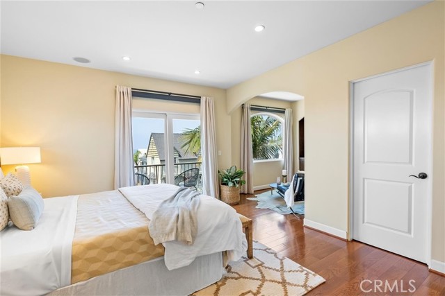 Primary ensuite bedroom with sitting area, large walk-in closet and ocean views