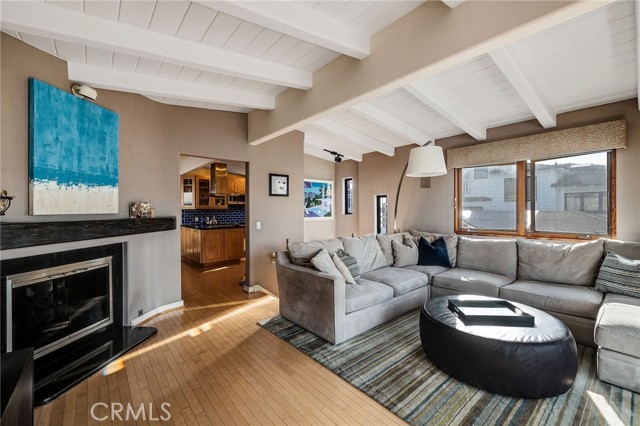 living room leads to kitchen and dining room
