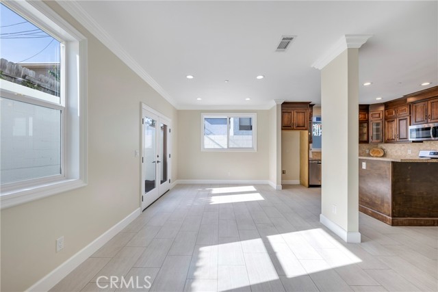 View of kitchen & dining room from far side of living room.