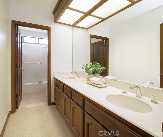 Upstairs guest bathroom with double sinks