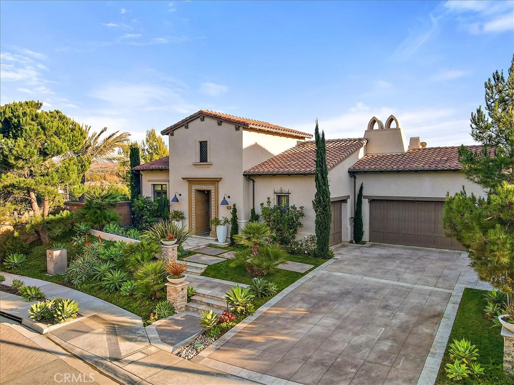 Stunning & sophisticated 4,018 sq. ft. single-story home w/expansive valley & peek ocean view on over a 1/2-acre private, corner lot. Behind the gates of the exclusive Olivia limited development community w/40 semi-custom homes. Bestselling floor plan built in 2017 featuring 4 bdrms/4.5 baths masterfully designed & extensively upgraded w/great attention to detail. Enter this dream home & experience all the luxuries of this expansive open concept floor plan with captivating views of the hills of SJC. A beautiful wrought iron gate will greet you as you pass an expansive covered loggia & spacious courtyard. Walk into the Great room w/beamed ceilings & floor to ceiling fireplace featuring a full bi-fold door opening wall system & adjacent dining room wall open to a 2nd covered loggia & the backyard creating the perfect indoor/outdoor luxury living experience. As you walk through the loggia enjoy this inviting saltwater pebble tech pool/spa w/glass tiles & sheer descent water features. Enjoy three outdoor sitting areas each w/firepit, mature landscaping, 6 water fountains & scenic views to complete the ambiance. Gourmet kitchen is a chef's dream complete w/stainless Wolf 6 burner, 48” gas range w/griddle for seared masterpieces. Bosch dishwasher & Sub-Zero refrigerator. European cabinetry w/self-closing doors, quartz counters, center island w/counter seating & an extra-large walk-in pantry. Master bdrm w/private backyard access & a spa-like bath w/dual sinks, seated vanity area, separate tub/shower & large walk-in closet. Set apart from the master are 2 secondary bdrms each w/private ensuite bath & a bonus room makes a perfect media room/office. The Casitas (4th bdrm) w/ensuite bath has a private entrance makes the perfect guest retreat. Oversized laundry room w/cabinets, utility sink & window. Enjoy the high-end finishes T/O. 7 French doors, wood flooring, 7” baseboards, custom paint, designer wall coverings, window coverings & lighting T/O. Home theater in great room, volume-controlled speakers in every room. Sonance Audio System for music in/out. SST security & cameras system. Finished 3 car garage w/epoxy floors. Proximity to public schools & top-rated private schools such as St. Margaret's & Capistrano Christian. Approx. 2 miles to Doheny Beach & Dana Point Harbor, less than a mile to SJ shops. 1.3 miles to the SJ Train Depot. Minutes to beaches, bike trails, horse stables, golf, local dining, shopping & more. Low Tax Rate, No Mello Roos.