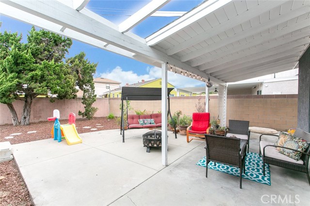 Fenced and semi-covered Patio and Backyard is perfect for family gatherings and playground for kids.