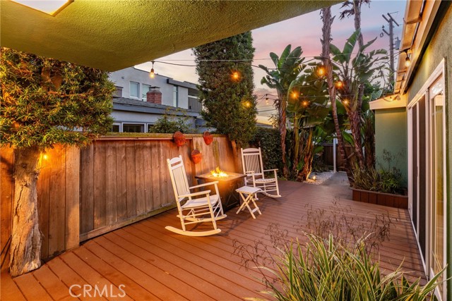 If the backyard isn't large enough.....you can sit back and relax on the spacious entryway deck.