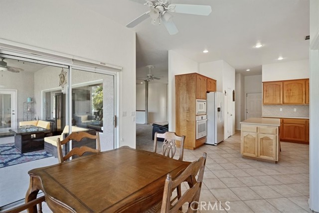 Breakfast Nook Featuring The Kitchen, Entrance To The Family Room and Covered Patio.