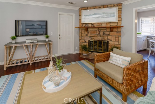 Stone fireplace and door to the attached garage