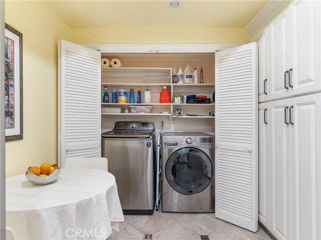 Eat-in area, laundry & cabinets.