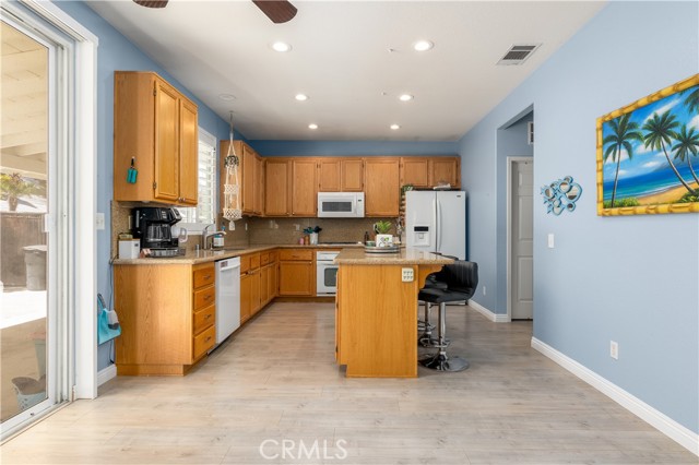 Kitchen with island and recessed lighting.