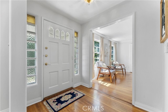 Imagine greeting company while they wait for you at your front door. Throughway leads to living room. Not seen is the throughway to the dining room and the hallway to lower level bathroom and stairs (not facing the front)