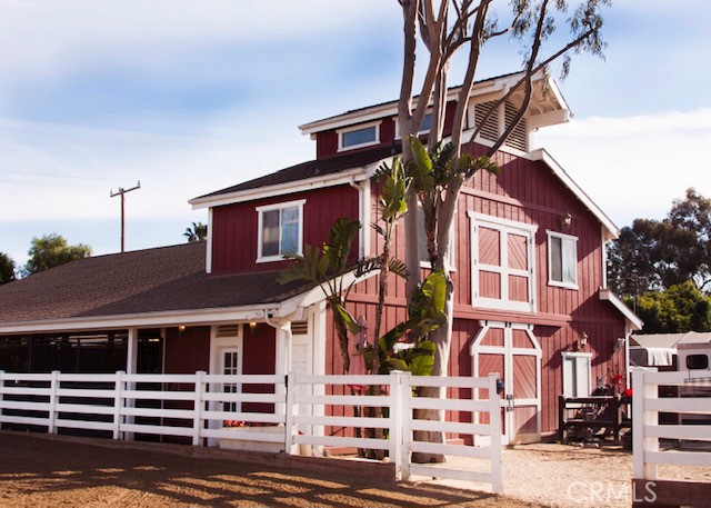 20416 SW Cypress Street Newport Beach, California Rarely on the market, this iconic Equestrian property spans just shy of an ACRE offering TWO side-by-side improved parcels that border Newport‘s Back Bay Nature Reserve. This ENORMOUS HORSE PROPERTY is OVER 39,500 SQUARE FEET, zoned for 12 horses and trailer parking and is accessible by automatic gate. This unique Ranch offers TWO 6-horse Barns, with Lights throughout, Fans in each stall, Mats in breezeways, attached Feed/Supplement Room, Multiple Tack Rooms, One Turnout Stall and Wash Rack. Each barn also includes Fly Abatement Systems, Gutters and Security Cameras which cover the entire property. One barn includes a half bath and spacious upper level which can be utilized as a guest house, an office or entertaining space complete with vaulted ceilings and is extremely light and bright. Next to the barns you will find a Four-Horse Priefert Horse Walker and Huge Arena with lights and drainage, Cross Ties, an automatic Sprinkler System and Hay Barn. The Ranch also encompasses two charming homes that have been lovingly remodeled and restored to maintain their vintage charm yet provide all of today’s modern conveniences. The main house offers 2 bedrooms and 1 bath, Fireplace, Wood flooring, Air Conditioning, Newer Windows, Newer Dishwasher, Newer 4-burner stove, Newer Roof, a Dutch door, an Outdoor Fireplace and a gorgeous entertaining space including a Koi Pond, Lemon & Avocado trees and a Water Feature. The second quaint home offers 1 Bedroom, 1 Bath, a Fireplace, One Detached Garage, Air Conditioning, Newer Roof, and a Walk-in Cedar-lined closet. This exceptional Ranch has been updated with every attention to detail sparing no expense including the structural components of the parcels which includes one Sump Pump with two industrial Pumps inside located in an underground vault for optimal drainage. Enjoy this spectacular property and its close proximity to the Back Bay for hiking, biking and horseback riding with easy access to the John Wayne Airport, the beach, restaurants and shopping.