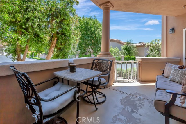 Private rear patio with easy access to additional parking