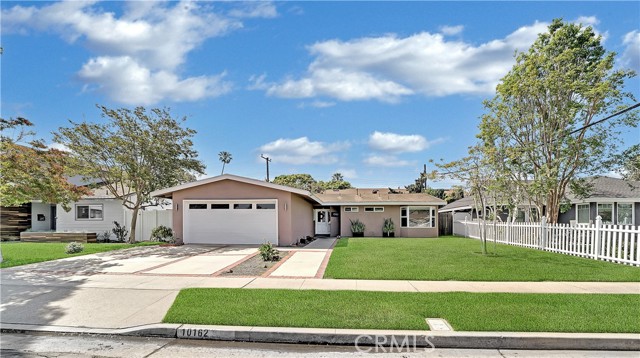 10162 Cutty Sark Drive Huntington Beach, California Completely remodeled 4 bedroom single level home, just a short bike ride to the beach and walk to many restaurants, shopping and parks! Upgraded throughout with brand new hard surface flooring, custom paint, crown moulding, whole house fan, custom light fixtures, new baseboards and so much more! Living room with custom stacked stone fireplace and mantle. Kitchen with all newer cabinets, granite counter tops, stainless steel appliances and sunny breakfast nook with built-in seating and writing desk. Master suite with dual closets and direct access to remodeled bathroom. Easy maintenance front and rear yard with trees and grass. Great family neighborhood with excellent schools and quiet, interior location! Must see!