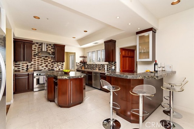 Custom cabinetry, Frigidaire appliances, Island and bar!