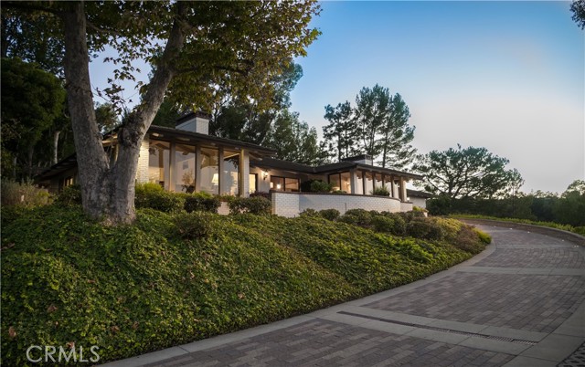 With a beautiful paver driveway ascend to a one of a kind home.