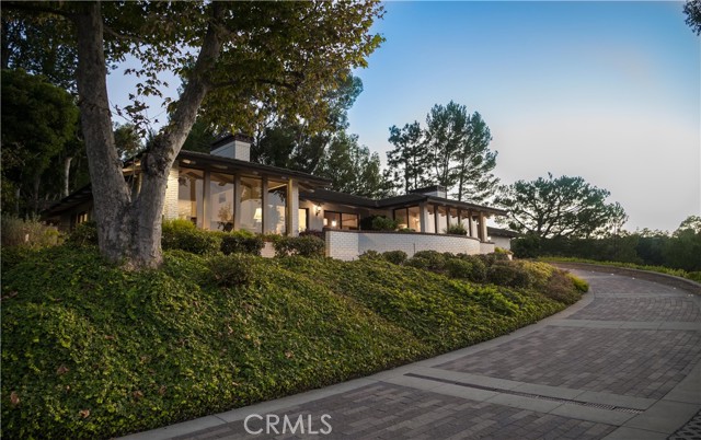 With a beautiful paver driveway ascend to a one of a kind home.