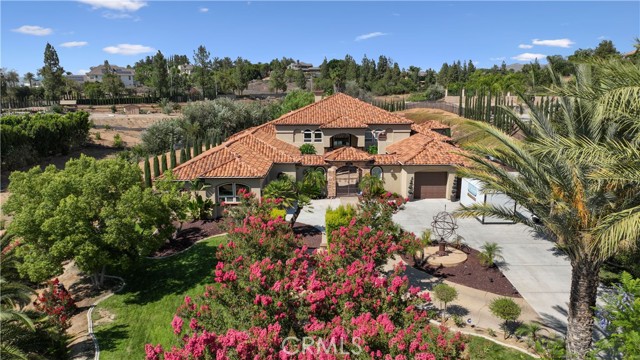 Alessandro Heights offers a fantasticopportunity to be part of a beautiful community of luxury homes. Situated & perched in the Hills of Riverside Talcey Terrace is a single-level, custom-built Spanish Home, offering a tranquil and private countryside villa. This home is just a few minutes from downtown Riverside; You will love driving into your new driveway smelling jasmine and honeysuckle. Upon entering the foyer of thishome, you are greeted with a welcoming open-floor concept.The great room features a custom-built fireplace, 25 ceilings, and dramatic windows with exquisite views of the outdoor living space and canyons. Adjacent to the great room is a gourmet kitchen with an abundance of cabinets anda massive Island to bring the whole family together for a gourmet meal. Talk about the perfect place to entrain family and friends or imagine more special occasions utilizing the formal dining room for private dinner parties. The favoredMain Suite is equipped with a steam shower, led lights, and Bluetooth. and also presents relaxing views of the outdoor living space. The pice de resistance of the estate is the outdoor living area that showcases the countryside lifestyle with a bit of taste of modernization by surrounding you with a tranquil ambiance. The centerpiece of the outdoor living space is ideal for hosting large gatherings, or If you are leaning toward a smaller, more intimate affair, experience the cozy custom-built fireplace. Other amenities include the Sports Court, Inside Gym, Home Theater, Outdoor Mega Chess Game, Putting Green, and Archery range. The attic is 300Alessandro Heights offers a fantasticopportunity to be part of a beautiful community of luxury homes. Situated & perched in the Hills of Riverside Talcey Terrace is a single-level, custom-built Spanish Home, offering a tranquil and private countryside villa. This home is just a few minutes from downtown Riverside; You will love driving into your new driveway smelling jasmine and honeysuckle. Upon entering the foyer of thishome, you are greeted with a welcoming open-floor concept.The great room features a custom-built fireplace, 25 ceilings, and dramatic windows with exquisite views of the outdoor living space and canyons. Adjacent to the great room is a gourmet kitchen with an abundance of cabinets anda massive Island to bring the whole family together for a gourmet meal. Talk about the perfect place to entrain family and friends or imagine more special occasions utilizing the formal dining room for private dinner parties. The favoredMain Suite is equipped with a steam shower, led lights, and Bluetooth. and also presents relaxing views of the outdoor living space. The pice de resistance of the estate is the outdoor living area that showcases the countryside lifestyle with a bit of taste of modernization by surrounding you with a tranquil ambiance. The centerpiece of the outdoor living space is ideal for hosting large gatherings, or If you are leaning toward a smaller, more intimate affair, experience the cozy custom-built fireplace. Other amenities include the Sports Court, Inside Gym, Home Theater, Outdoor Mega Chess Game, Putting Green, and Archery range. The attic is 3000 sqft preppedfor additional living space. Enjoy all Riverside has to offer in this exquisite, one-of-a-kind Spanish-style estate where multiple families and generations can live separately or join together in a magnificent private outdoor setting surrounded by pastoral landscape and rural terrain.
