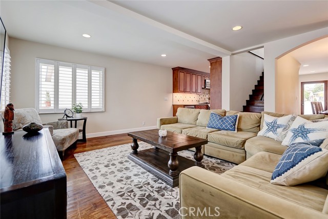 Spacious living room with gleaming hardwood floors