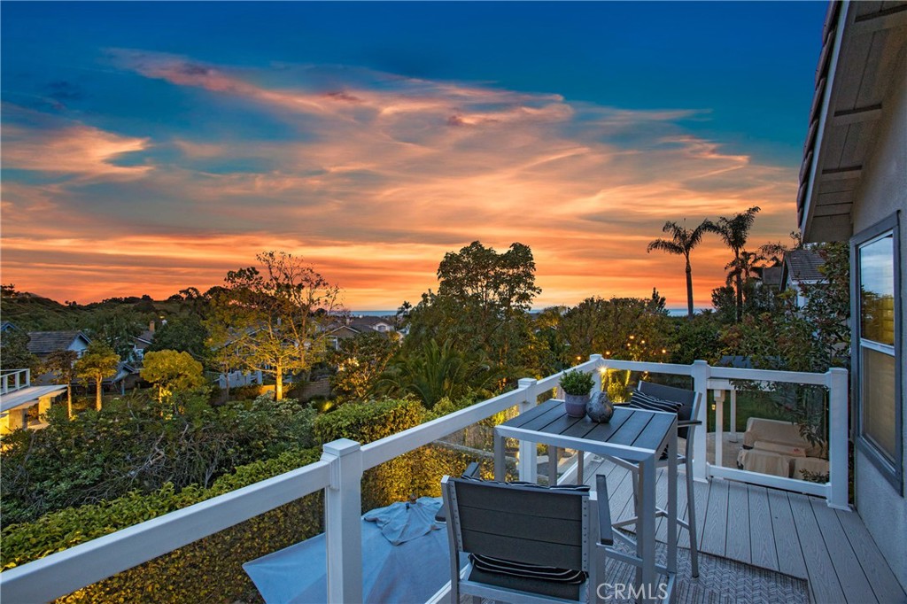 OCEAN VIEWS FROM THE HIGHEST CUL DE SAC STREET IN GATED BEAR BRAND RIDGE. This is a stunning 5 bedroom home (with one on the main floor with double doors) and one that is an oversized/bonus room that can be used as a versatile bedroom, upstairs family room, office, gym or study room.  Countless upgrades in every room including California Classics wood flooring, full PEX repipe, and new interior doors.  Cathedral ceilings in the formal living & dining rooms. Spacious upgraded kitchen w/granite counter tops, new light fixtures, & lots of natural light which opens up to the kitchen nook with door out to backyard. The yard has a pool plus ample space for dining al fresco.  The kitchen is adjacent to the family room and has a Walker Zanger tiled fireplace and dry bar.  Upstairs is a large primary bedroom suite w/ a deck with sunset and ocean views. Beautifully upgraded primary bath with free standing tub, shower, dual sinks, and high end fixtures and finishes. Large walk in closet plus a newly tiled fireplace. Secondary bedrooms and full bathroom w/dual sinks complete the upstairs.  New dishwasher and newer hot water heater.  Recently refreshed front and back landscaping with new plants and ground cover.  Owned solar and EV charger in the garage. Bear Brand Ridge has a community park & gated access and is close to shopping centers, restaurants, Cinepolis movie theater, 5 star resorts, excellent schools, biking/hiking trails, and access to world class beaches.