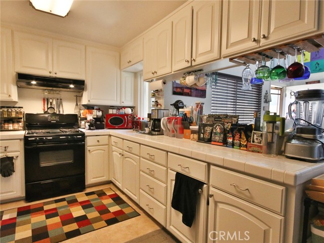 Another photo of the many cabinets in the kitchen.