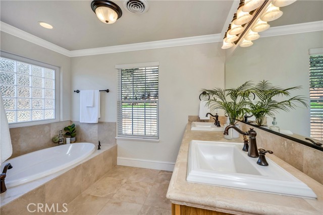 Primary bathroom with double sinks & soaking tub.