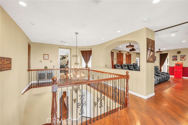 Upstairs landing with view into the theater with the Gym down the hall