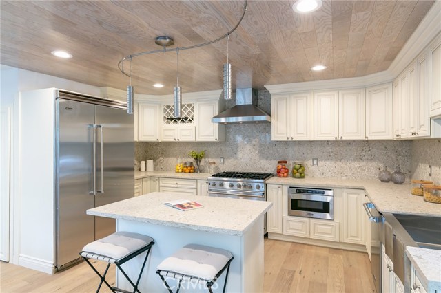 13082 Mindanao Way 1 Marina del Rey, California Chef's Delight! Viking appliances, a 48" Refrigerator, 6 top Range, Microwave, Dishwasher and a 5' Island fill the expanded Kitchen plus Pantry. Custom cabinets with Italian Quartz Counter Tops and back splash. The ceiling boasts wood with recessed lighting and pendulum track Lights. New double pane Value Windows throughout and Sliders exiting to your own private patio with great sun for the corner unit. The open concept extends from the Kitchen through to the Living Room. French doors allow great light. French Oak floors throughout. Sleek Glass Railings lead us upstairs. New NRG Hvac was installed in the attic. New LG Washer and Dryer on the second floor. This 2 bedroom 2 3/4 bath also has two areas that could be used as an office, sitting room or even a third bedroom. The Master Bath boasts a stand alone Tub, double Vanity, glass walled Shower, heated Towel Rack with cubby hole all hardware Hans Grohe. From here there is a view of the Tennis Courts and Pool. The walk-in Closet fills out the room. A great time to purchase in this complex as the HOA has almost $900,000 in reserves, is in the process of completing painting, roof sealing, drain cleaning, tree trimming and improvements to the landscaping.
24 Hour Guard Gated Community. OPEN SUNDAY 1-4!!!