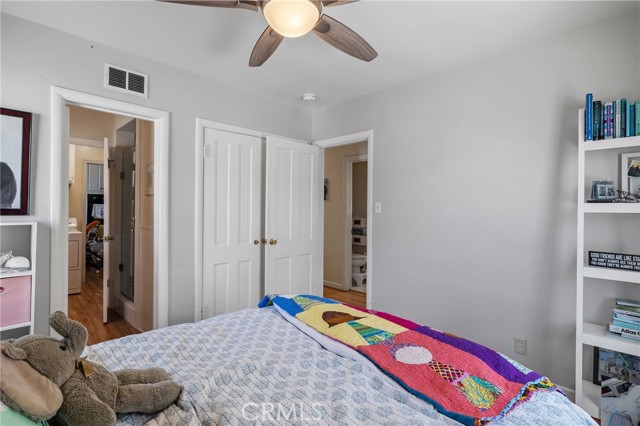 Second bedroom with door to laundry room