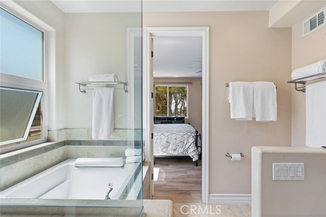 Enjoy your en suite bathroom and bedroom with ocean view to the west.