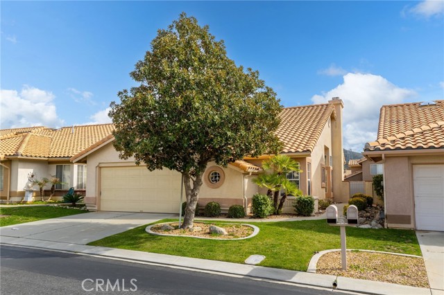 This charming Sunningdale model is located in the active guard gated 55+ senior community of Sun Lakes Country Club. Approx. 1,472 sq. ft., 2 bedroom, 2 bathrooms plus a den/office with atrium attached. This home has a free flowing floor plan with a large master bedroom with a walk-in closet. The kitchen has a spacious breakfast nook and sitting room. The living room boasts a fireplace and formal dining area. Garage hold two cars and has room for a golf cart or work bench. The private backyard with an alumawood patio cover and vinal fencing is perfect for entertaining! Easy maintenance front and backyard! Sun Lakes Country Club is a premier Active Adult Community offering many amenities: 24 Hr. Guard Gated, 2 Golf Courses-Championship and Executive, 3 Clubhouses, Grand Ballroom, 3 Pools (1 indoor) Tennis, Bocce Ball Court, 2 Restaurants, and many Social Clubs, and NO MELLO ROOS! Live the Resort Style Life at Sun Lakes.