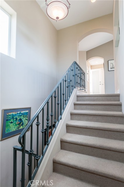 Carpeted stairway adds warmth and quiets footsteps.