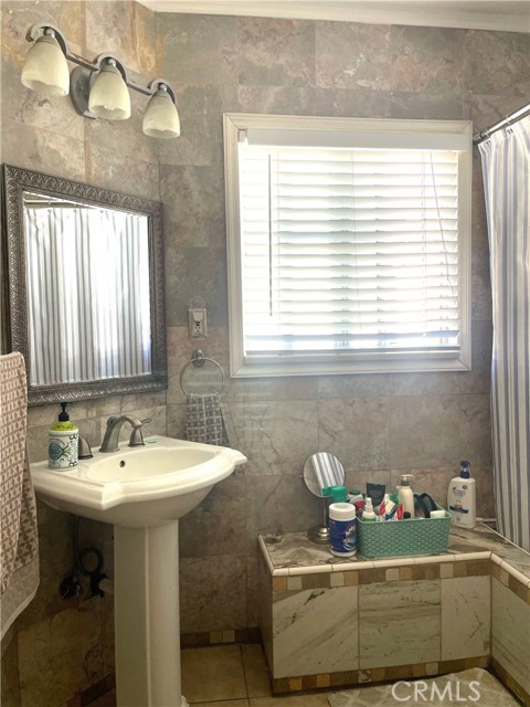 bathroom with tub and separate shower