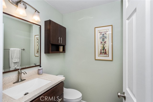 !/2 bath with corian counters easily accessible from all living areas.