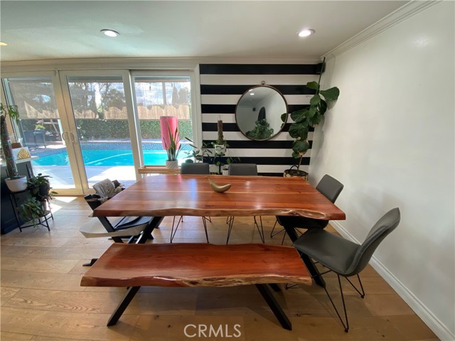 Formal dining room with view of beautiful swimming pool