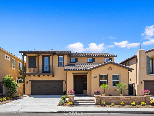 PHENOMENAL unobstructed VIEW in the Vista Del Verde community of Greenbriar. One of the MBK largest floor plans. Boast over 3,500 sqft of living spaces. Formal living and dining rooms offer ample room for family and friends. Sunny kitchen with island, mahogany cabinetry, stainless steel appliances, and walk-in pantry. One bedroom is on the main floor with its own full bath, perfect for guests. A bonus room next to the kitchen can be easily converted into a 5th bedroom or office. Upstairs master suite offers large sitting area, walk-in closet, luxurious bath with jetted tub, and romantic balcony with view to Catalina. Good size third and fourth bedrooms share a Jack & Jill bath. The huge loft can be a family entertaining room/recreational room. Disneyland fireworks can be seen from the cozy backyard. Walking distance to the community park and award-winning Lakeview Elementary. NO HOA and NO MELLO ROOS.