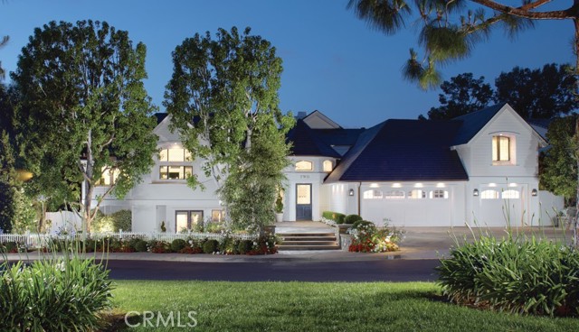 2 Royal Saint George Road Newport Beach, California Gracefully perched along the iconic 15th hole in the heart of Newport Beach’s exclusive guard-gated community of Big Canyon, this masterfully reimagined estate captures front-row fairway views and the serene beauty of a striking par-3 played over water. A true architectural showpiece, the home was taken down to the studs and transformed by the renowned Amber Interiors, blending bespoke finishes with timeless California elegance. Inside, rich walnut floors, custom millwork, designer lighting, and hand-selected wallpapers create a layered, textural experience that feels both refined and warmly livable. The interiors evoke a curated calm—where organic materials, soft architectural lines, and thoughtful craftsmanship create an ambiance that is both elevated and inviting. Designed for modern living, the home is powered by solar energy and enhanced with integrated smart home features including Control4 automation, surround sound, video surveillance, and more. Outside, a resort-inspired backyard features a PebbleTec saltwater pool, lush landscaping, and multiple entertaining spaces, making large-scale gatherings effortless. Upstairs, the sun-drenched primary suite offers a tranquil escape with sweeping fairway views, luxurious finishes, dual closets, and a spa-like bathroom retreat