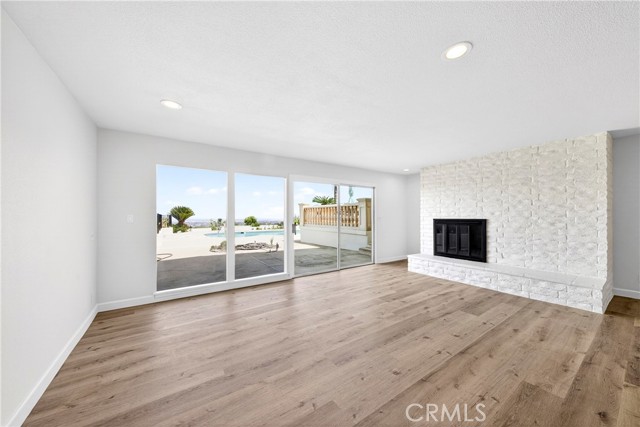 huge family room with fireplace and view