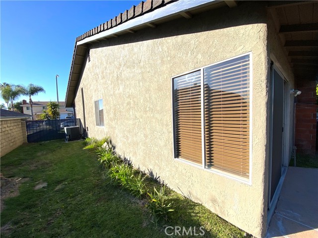 SIDE YARD WITH UPDATED AC UNIT