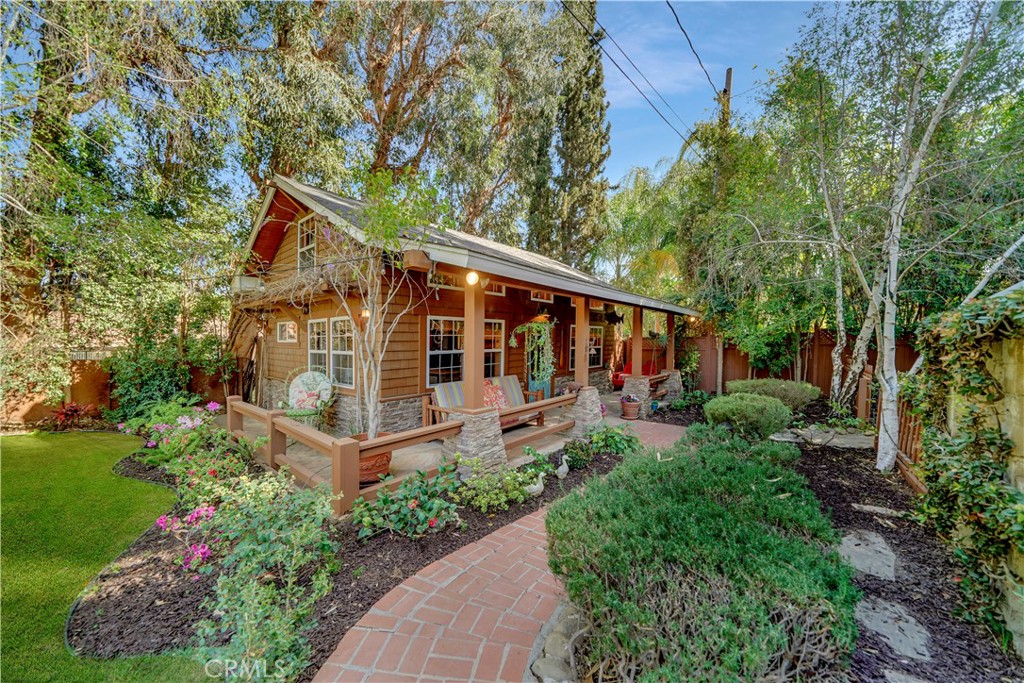 guest house surrounded by lush landscaping