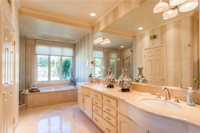 Master bathroom with jetted tub and separate shower (glass enclosure).