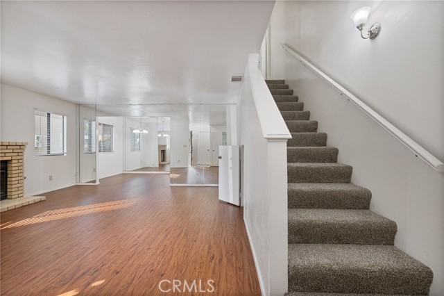 Stairs to full bathroom and both bedrooms