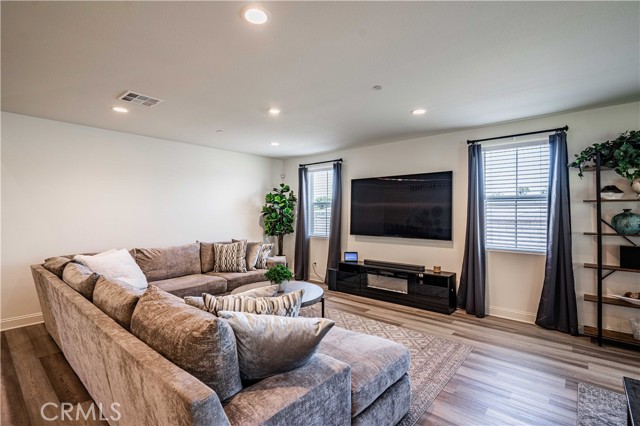 Great room has a cozy family room space.