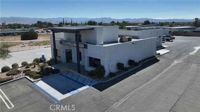 Outside Aerial POV: Subject property and Parking.