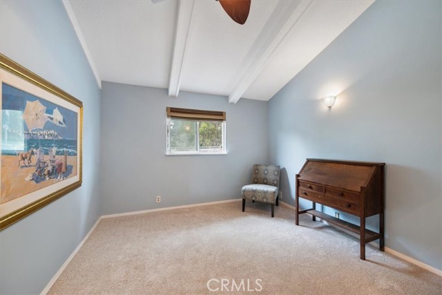 Bedroom #1 has raised ceilings and looks out at private yard area. Newly installed carpet
