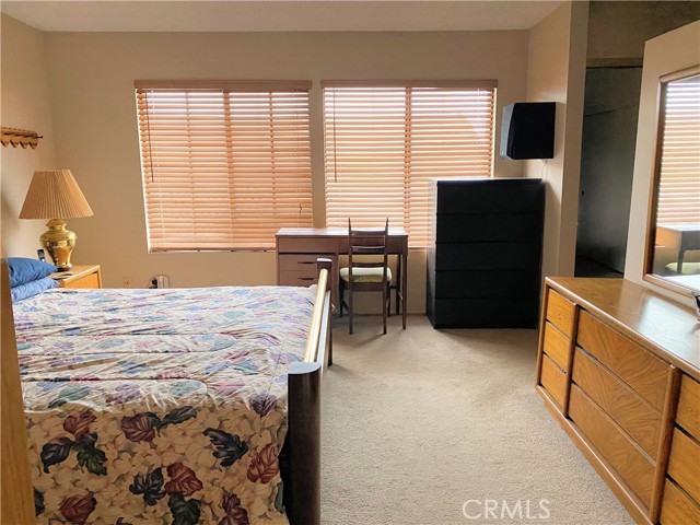 Large windows make this primary bedroom bright