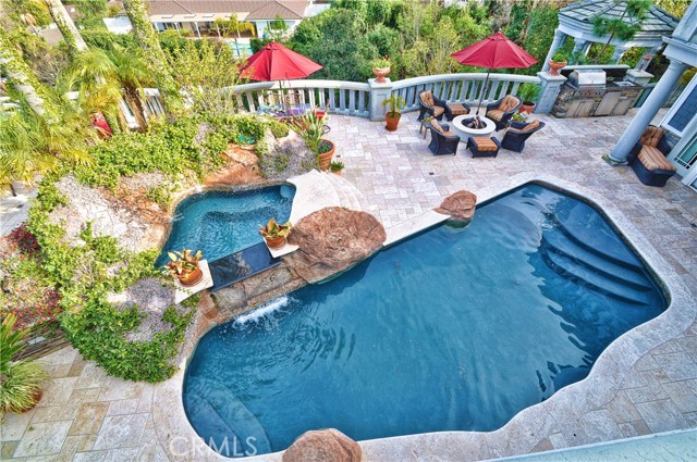 Pool, spa, waterfall, fire pit, gazebo and barbeque island