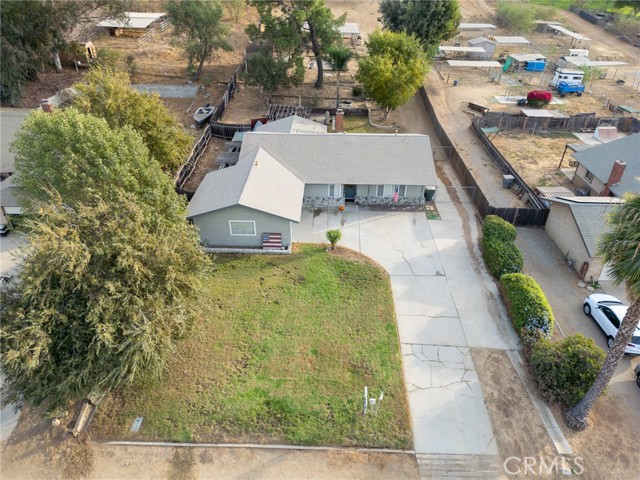 VIEW FROM THE STREET OR BRIDLE PATH OF HOUSE AND BACKYARD. DRIVEWAY ON RIGHT GOES ALL THE WAY TO THE VERY BACK