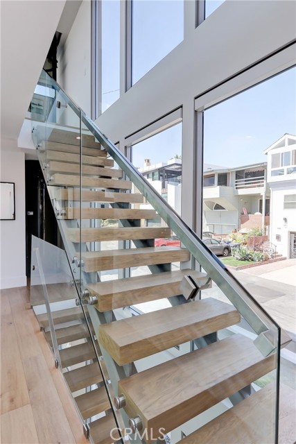 Floating staircase w/ glass rails