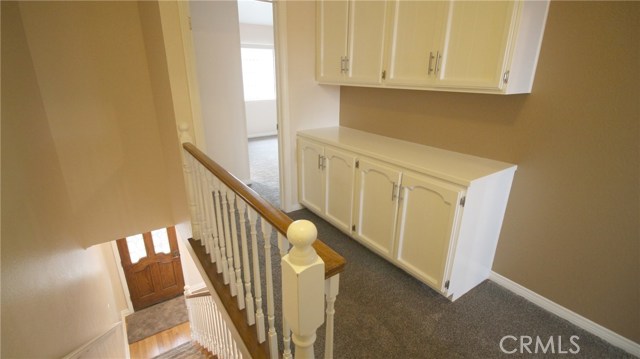 Upstairs hallway with storage in between 2 master bedrooms