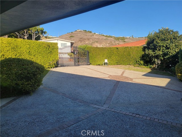 View of driveway and security gate