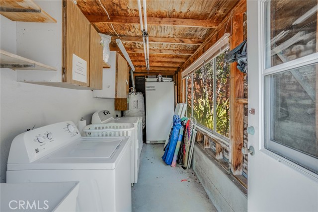 Laundry room attached to 2-car garage